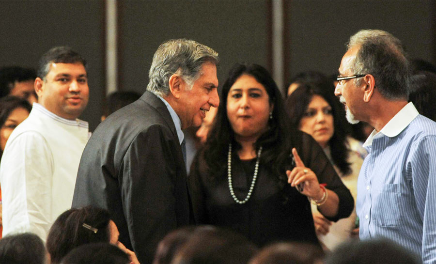 Ratan Tata interacts with a member of the audience at the 2014 event of the Ladies Study Group as social activist Sundeep Bhutoria looks on