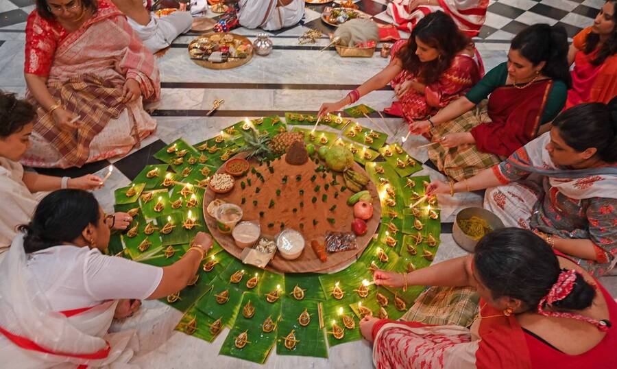 108 diyas lit up the place and 108 lotuses were offered as time transitioned from Ashtami to Navami on Friday
