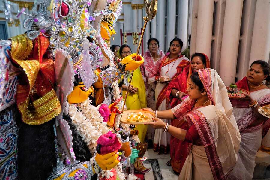 On Saturday, as Navami transitioned to Dashami, devotees bid farewell to the goddess with a heavy heart. In picture, at the 200-year-old Khelat Bhawan Rajbari in Pathuria Ghat Street, north Kolkata, a lady performs perform Devi Boron rituals  