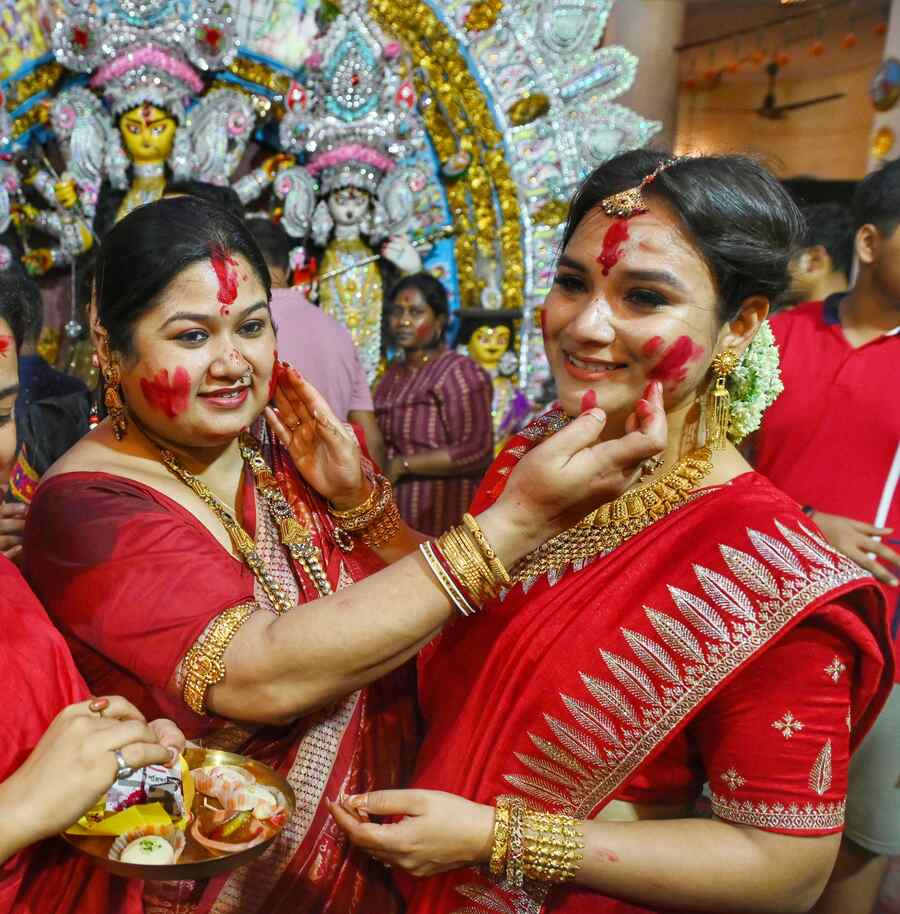 A quintessential part of the rituals to bid adieu to the goddess, ‘sindur khela’ follows boron. In picture, married women participate in the ritual after Boron at the Shiv Krishna Daw Bari in Burrabazar  