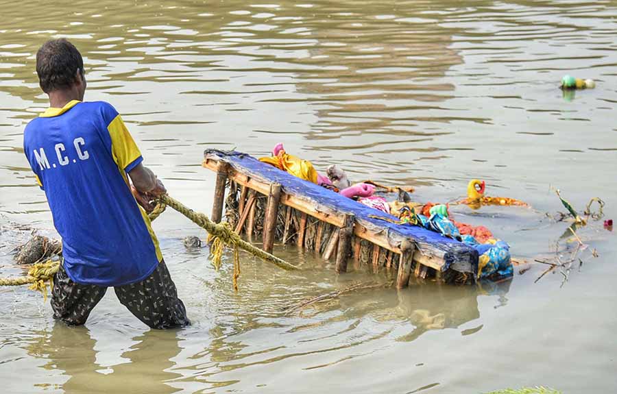 Durga idols were immersed at the Baje Kadamtala Ghat in north Kolkata on Saturday as part of Dashami rituals, however, the structures were immediately removed by workers of the Kolkata Municipal Corporation (KMC)