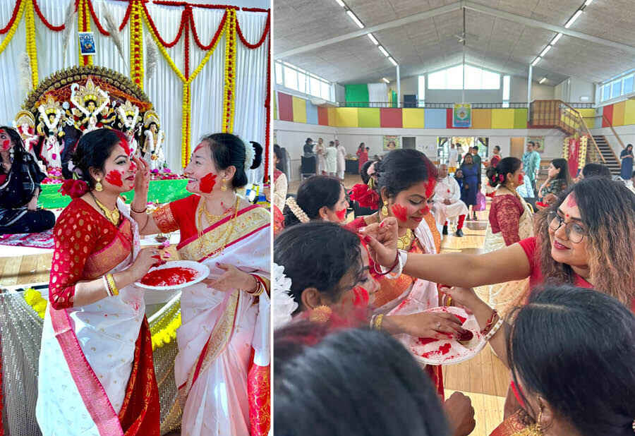 Women put vermilion on each other for the ‘sindur khela’ and bid farewell to Durga on the last day of the celebrations