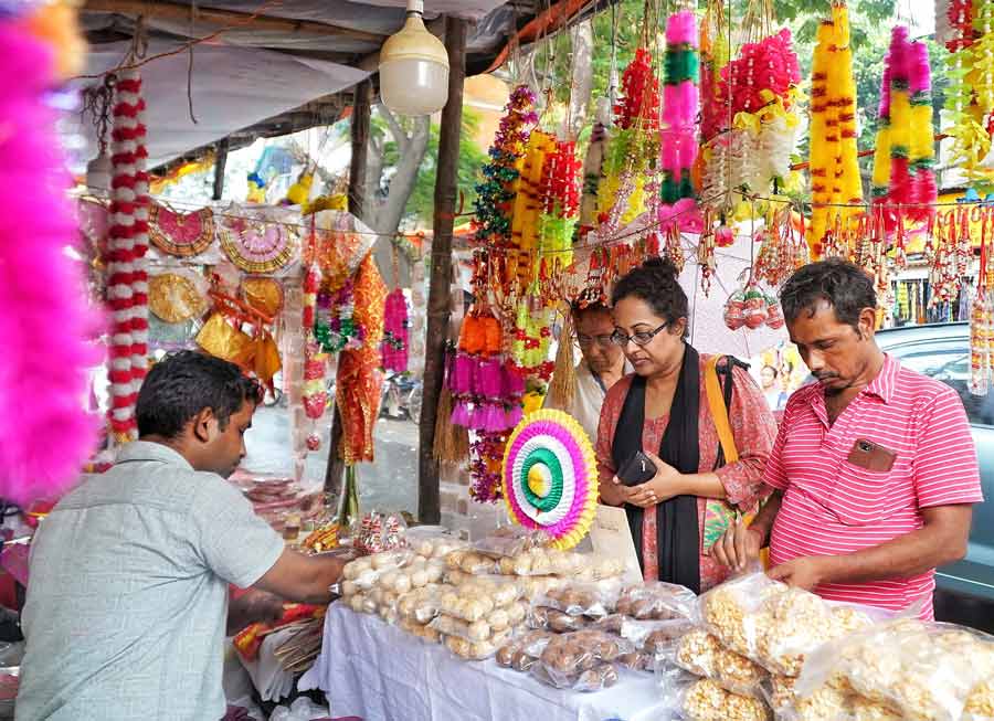 One day ahead of Lakshmi Puja, people were seen scouting Lake Market for last-minute shopping