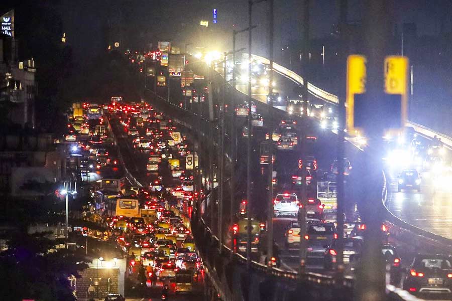 Vehicles stuck in a traffic jam on a road after heavy rainfall in Bengaluru.