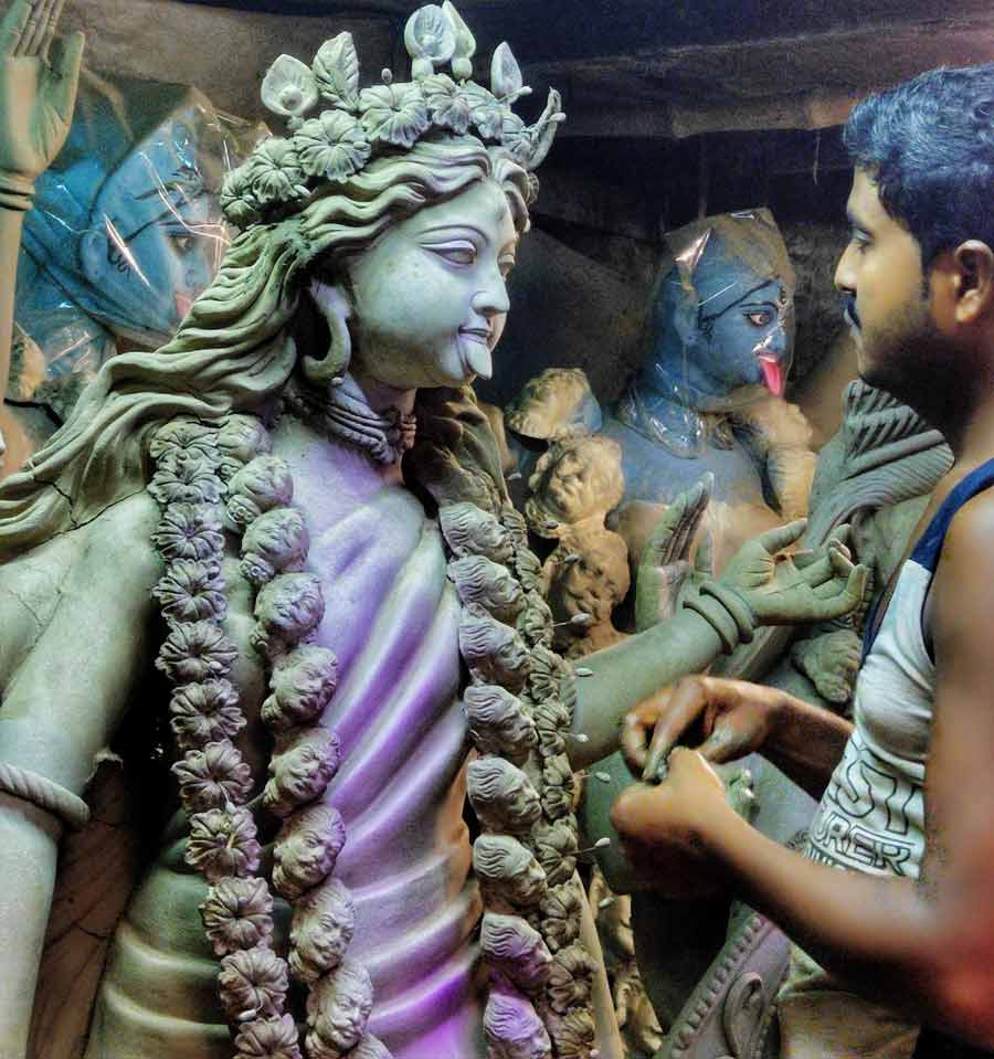 With only 11 days to go for Kali Puja, this artisan is busy completing an idol at Kumartuli  
