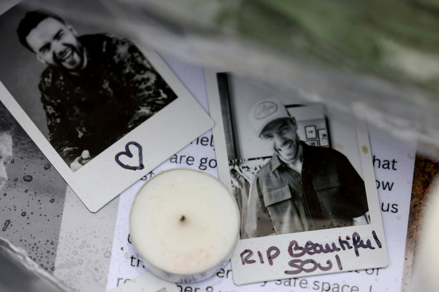 Fans gather to pay tribute to former One Direction singer Liam Payne in London.
