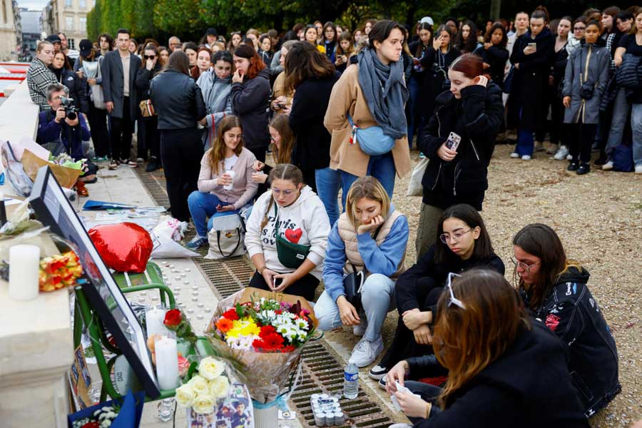 Fans gather and place tributes to former One Direction singer Liam Payne in Paris.