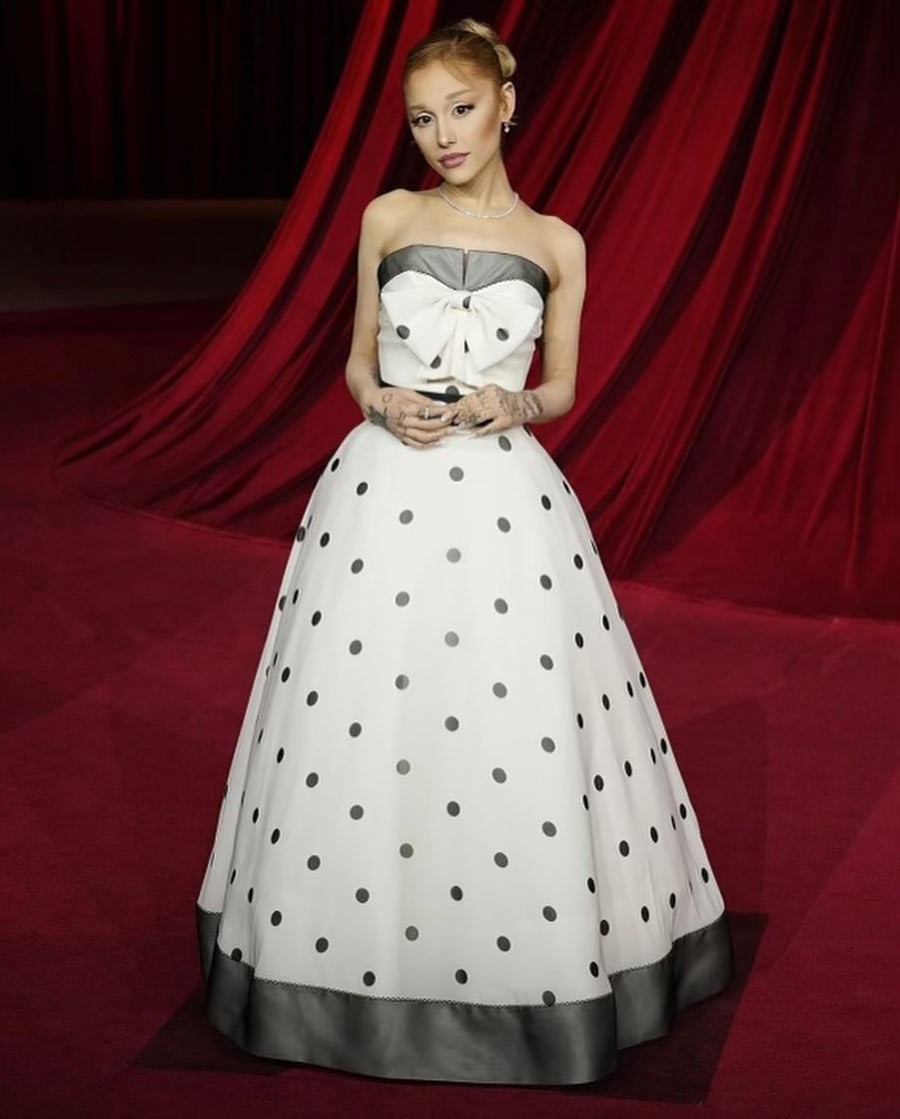 Ariana, who is soon going to feature in the musical fantasy Wicked, dazzled in a vintage off-shoulder Balmain gown with a striking white-and-black polka dot design. Featuring a full-ball skirt and a bow-accented bodice, the ensemble was a departure from the pink outfits she dons in Wicked and its promotional events. 