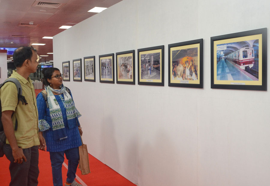 Visitors browse through photographs at an exhibition at the Esplanade station to mark Kolkata Metro Railway’s 40-year-long journey. The event will run till October 24 
