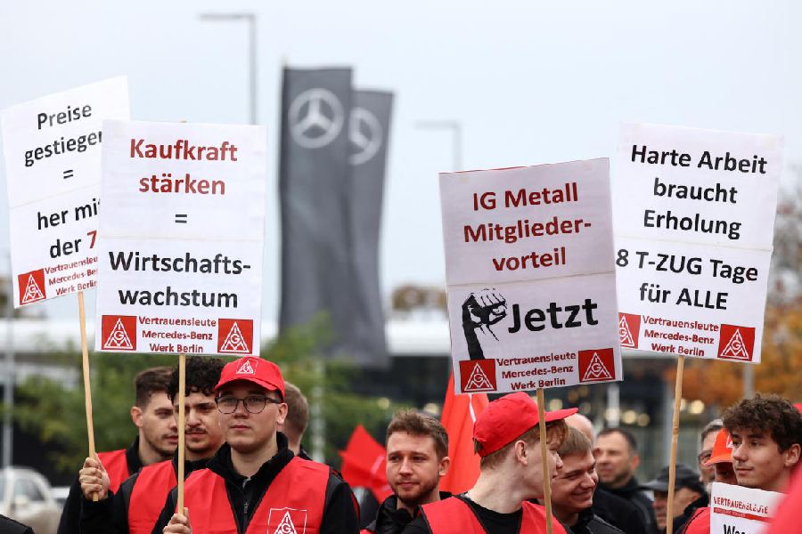 Protesters at the rally by the employees of German car maker Mercedes demanding higher wages, at a Mercedes plant in Berlin, Germany, October 29, 2024. This comes at a time when Volkswagen plans to lay off tens of thousands of staff and shrink its remaining plants in Europe's biggest economy. 