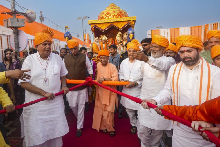 Uttar Pradesh Chief minister Adityanath pulls a chariot during the ‘Deepotsav’ celebration on the eve of ‘Diwali’, in Ayodhya, Wednesday, Oct. 30, 2024. PTI