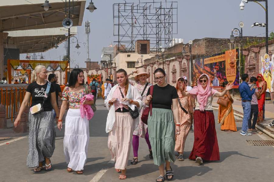 Foreign tourists on their way to the Ram temple in Ayodhya. PTI