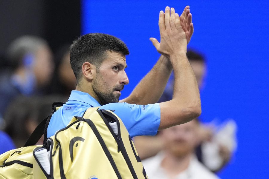 Novak Djokovic acknowledges the crowd after his third-round loss to Alexei Popyrin in New York on Friday.