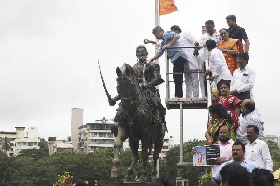 NCP (Sharad Pawar camp) leader Jitendra Awhad washes the statue of Chhatrapati Shivaji Maharaj in protest against the collapse of Malvan's Shivaji Maharaj statue, in Thane, Wednesday, Aug. 28, 2024.