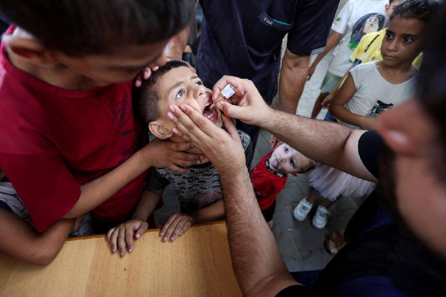  Palestinian child is vaccinated against polio, at a United Nations healthcare center in Deir Al-Balah in the central Gaza Strip, September 1, 2024