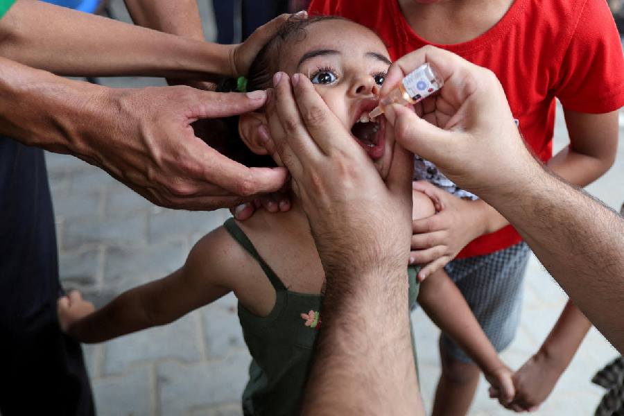A Palestinian girl is vaccinated against polio, at a United Nations healthcare center in Deir Al-Balah in the central Gaza Strip, September 1, 2024