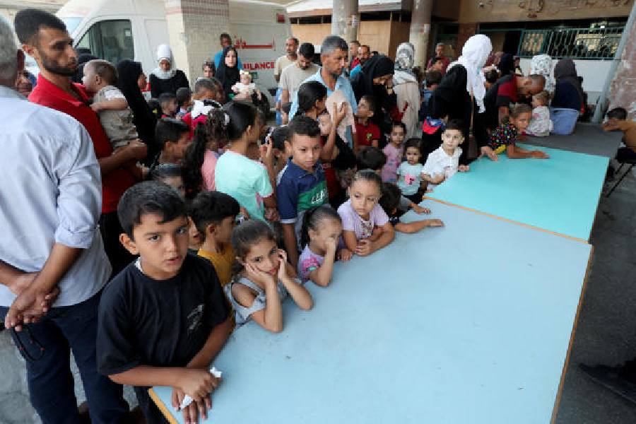 Palestinian children wait to be vaccinated against polio, at a United Nations healthcare center in Deir Al-Balah in the central Gaza Strip, September 1, 2024