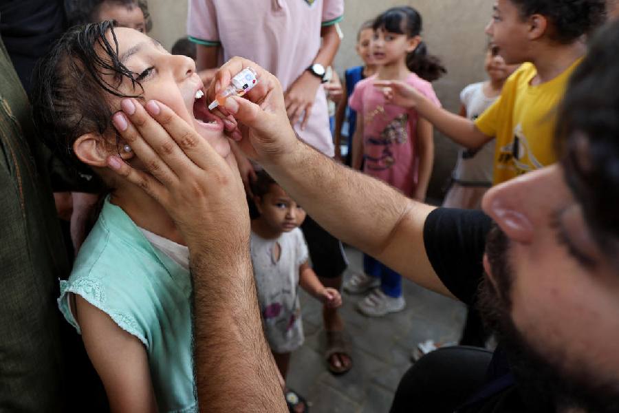 A Palestinian child is vaccinated against polio, at a United Nations healthcare center in Deir Al-Balah in the central Gaza Strip, September 1, 2024