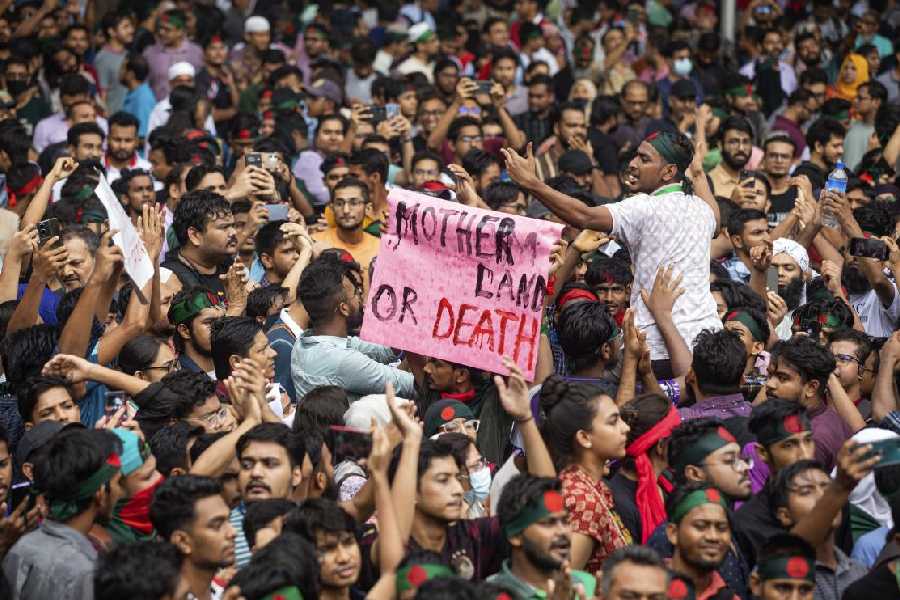 Protesters in Dhaka march on Saturday, August 3, 2024 against Sheikh Hasina and her government to demand justice for those killed in deadly clashes across Bangladesh