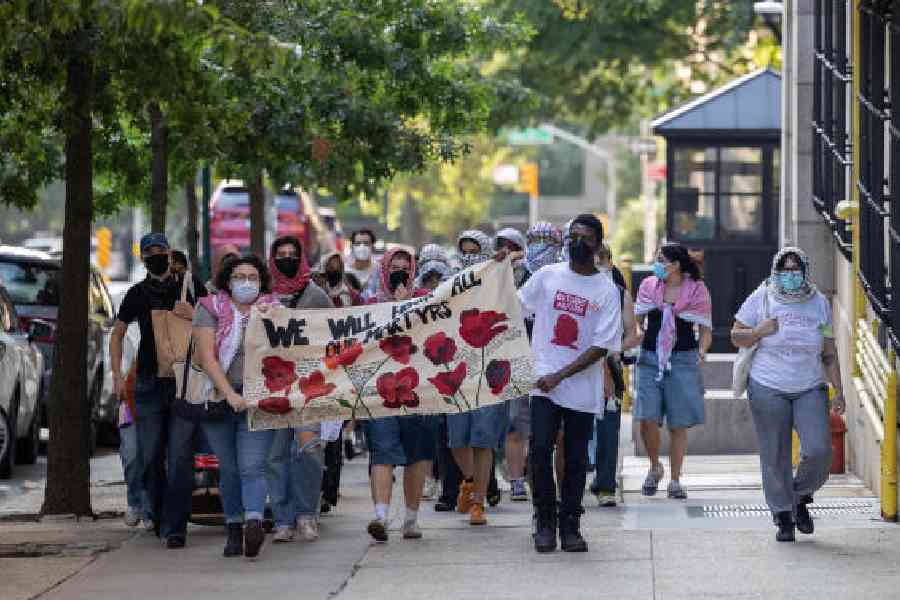 ID poof: Students protest the war in Gaza at Columbia University in the US. Hiding their identities is a must to protect their future. NYTNS/Caitlin Ochs