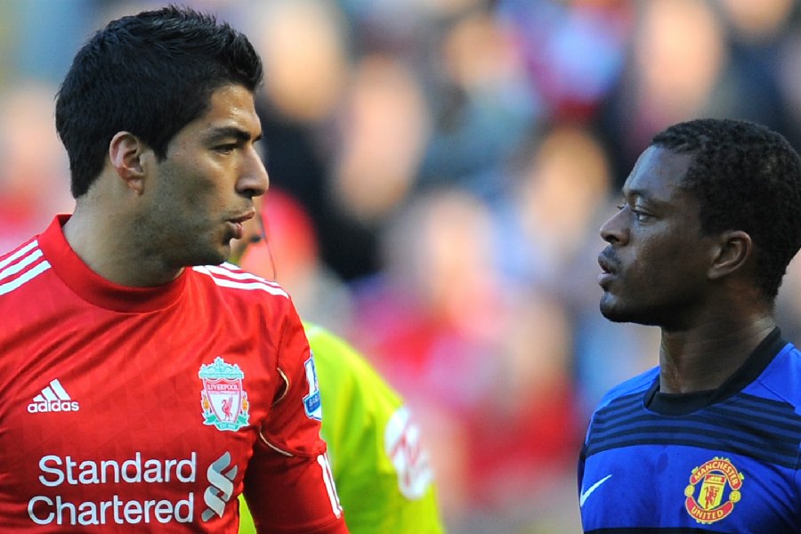 Luis Suarez and Patrice Evra during a Premier League match in 2011.