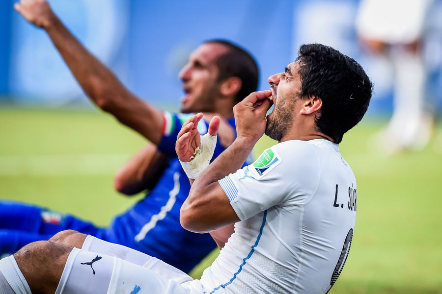 Luis Suarez after biting Georgio Chiellini's shoulder in FIFA World Cup 2014.