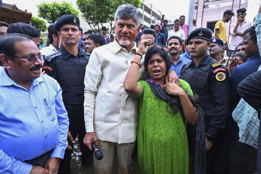 Chief Minister N Chandrababu Naidu meets an affected person during his visit to the flood-affected areas, in Vijayawada on 3rd Sept
