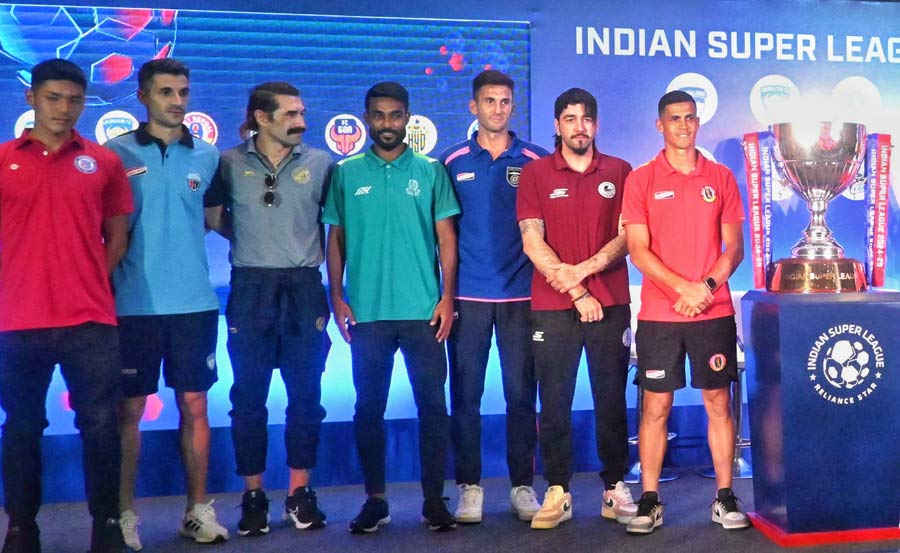Coaches and captains of all teams taking part in the Indian Super League 2024-25 pose at a news meet at a city hotel. The teams are Bengaluru FC, East Bengal, Jamshedpur FC, Mohammedan Sporting Club, Mohun Bagan Super Giants, North East United FC, Odisha FC and Punjab FC