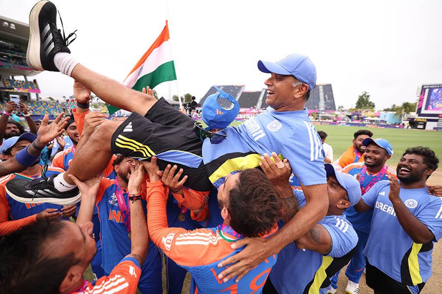 Dravid celebrating with the Indian players after winning the ICC Men’s T20 World Cup in the West Indies
