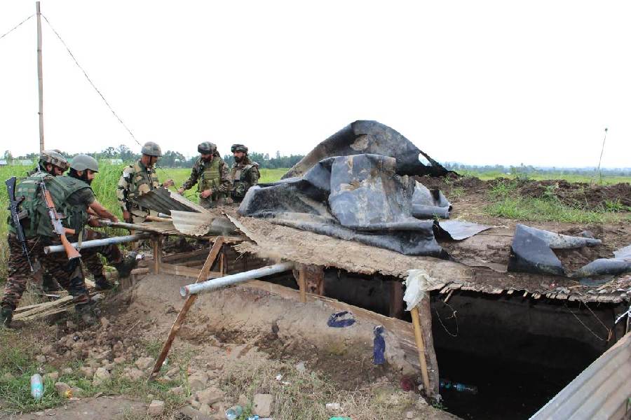 Army and Border Security Force (BSF) personnel dismantle the Kuki militants' bunkers in Bunglon area of Manipur on August 11, 2024.. 