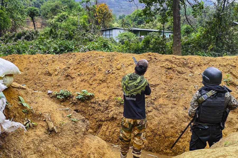  'Village volunteers' stand guard at a bunker set up in conflict-hit Manipur on May 5, 2024