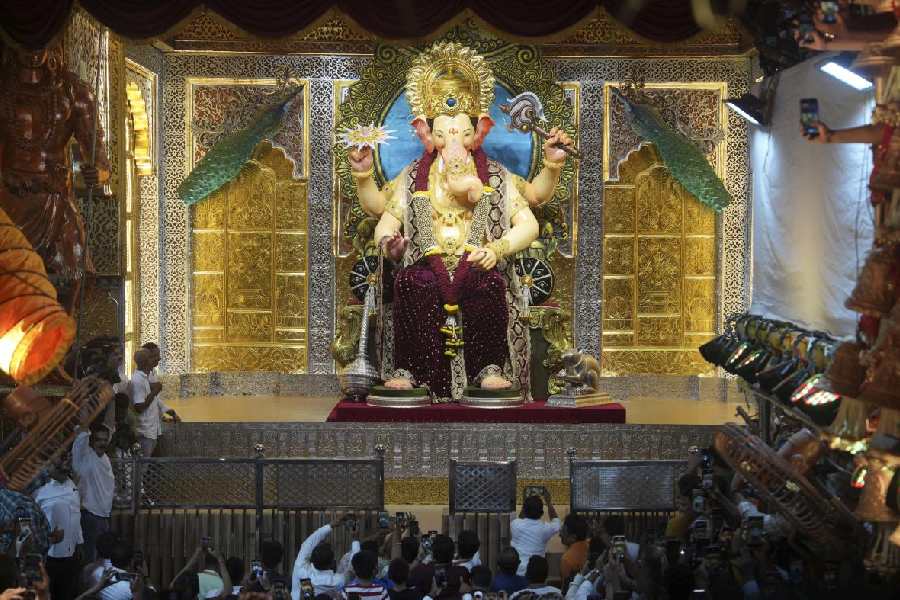 The idol of Lord Ganesha at Lalbaugcha Raja Sarvajanik Ganeshotsav Mandal being unveiled, in Mumbai.