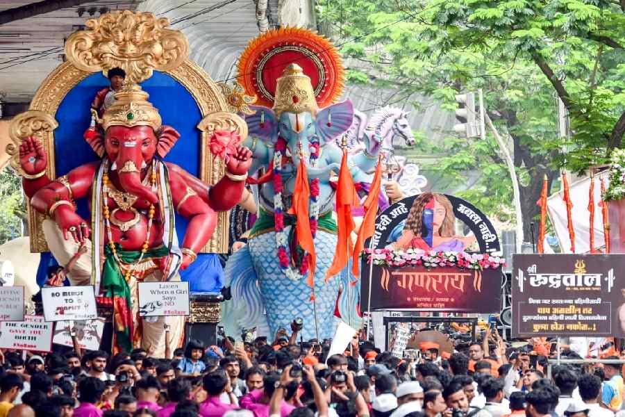 Lord Ganesh idols being carried by devotees to a pandal ahead of the Ganesh Chaturthi festival, in Mumbai.