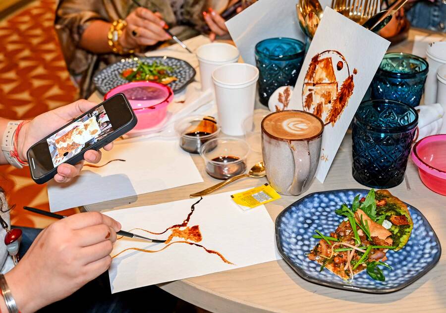 The participants were given all the art supplies and coffee concoction. The paintings were made by diluting the coffee with water to bring different shades