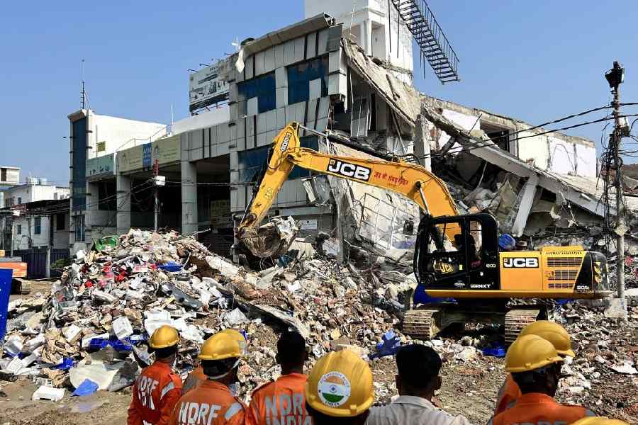 NDRF and SDRF personnel during a relief work underway a day after a building collapsed causing 8 people death, in Lucknow, Sunday, Sept. 8, 2024. 