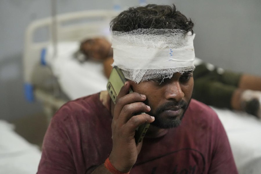 An injured admitted at a hospital after a three-storey building collapsed, at Transport Nagar area in Lucknow, Saturday, Sept. 7, 2024.