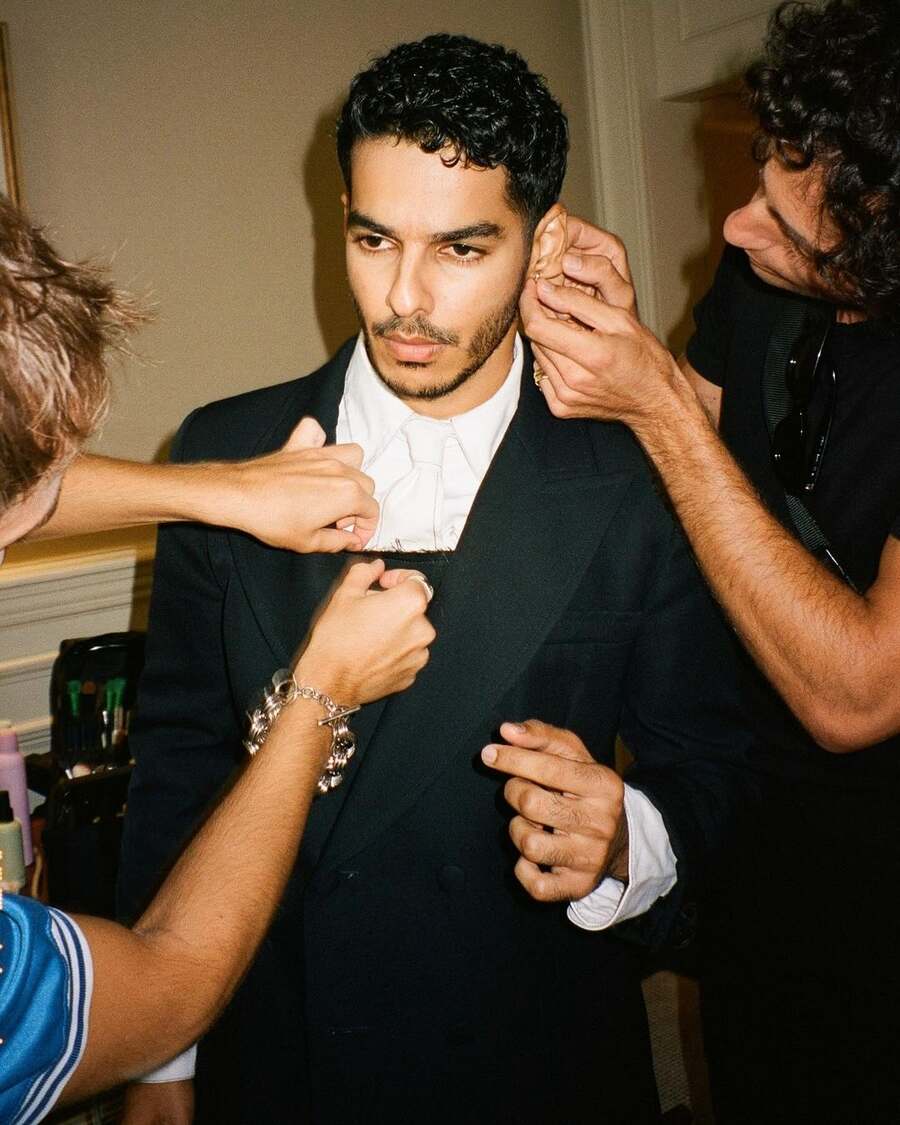 One of the pictures shows makeup artists putting finishing touches to Ishaan’s look before he faces the camera.