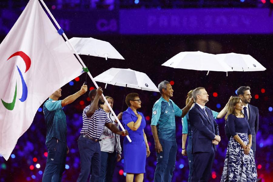 President of the Paris 2024 Organising Committee Tony Estanguet, Paris' mayor Anne Hidalgo, Mayor of Los Angeles, Karen Bass, International Paralympic Committee President Andrew Parsons and the Paralympic flag are seen during the closing ceremony