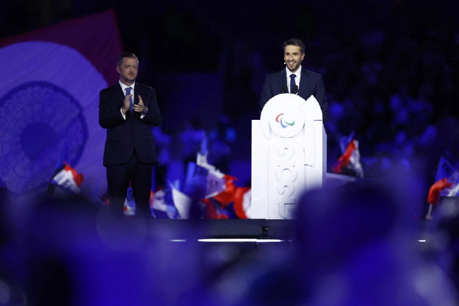 Paris 2024 president Tony Estanguet gives a speech as International Paralympic Committee President Andrew Parsons looks on during the closing ceremony.