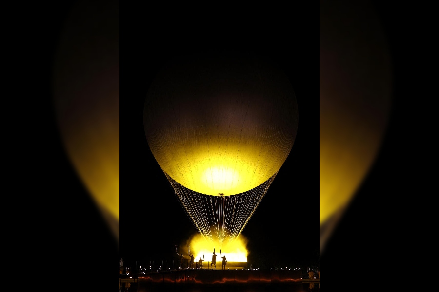 Charles-Antoine Kouakou, Nantenin Keita, Fabien Lamirault, Alexis Hanquinquant and Elodie Lorandi lit The Olympic cauldron.