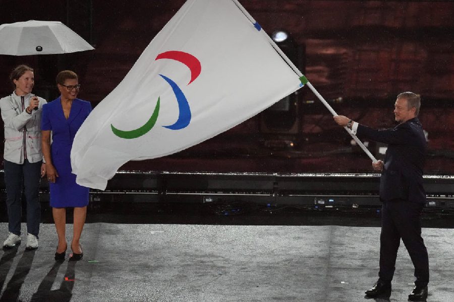 International Paralympic Committee President Andrew Parsons holding the Paralympic flag during the closing cermony.