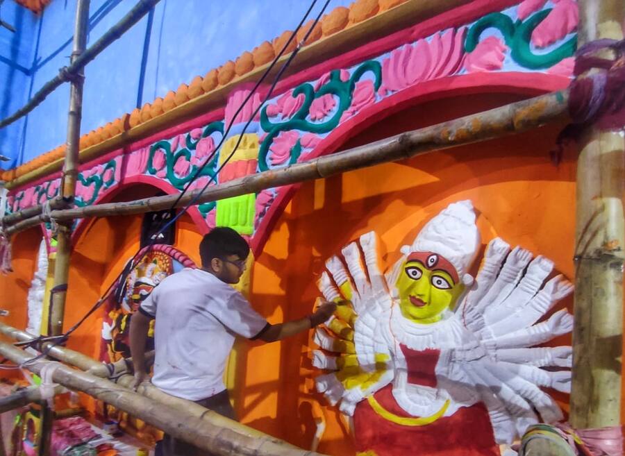 An artist busy decorating the Durga Puja pandal at Jorasanko Sarbojonin in north Kolkata