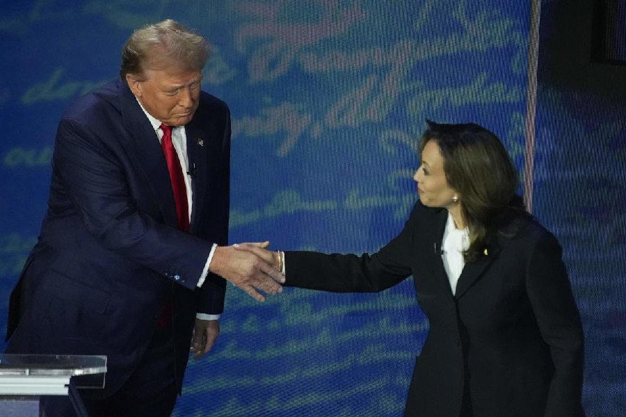 Republican presidential nominee former President Donald Trump shakes hands with Democratic presidential nominee Vice President Kamala Harris during an ABC News presidential debate at the National Constitution Center.