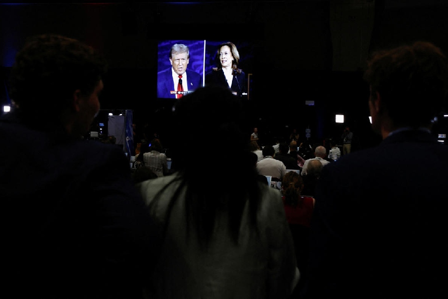 A screen displays the presidential debate hosted by ABC between Republican presidential nominee, former U.S. President Donald Trump and Democratic presidential nominee, U.S. Vice President Kamala Harris in Philadelphia, Pennsylvania, U.S.