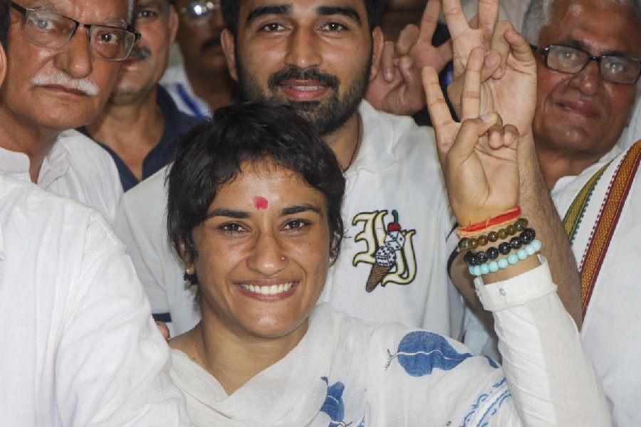 Former wrestler and Congress candidate from Julana constituency Vinesh Phogat with husband and wrestler Somvir Rathee and others during her nomination filing for the upcoming Haryana Assembly elections, in Jind district.