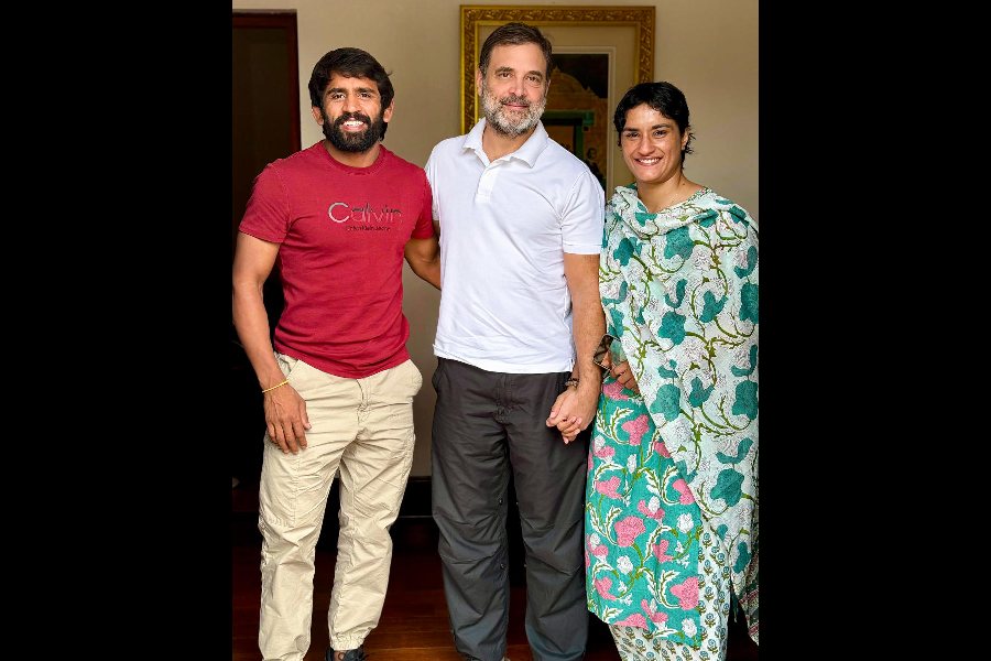 Leader of the Opposition Rahul Gandhi with wrestlers Vinesh Phogat and Bajrang Punia in New Delhi.