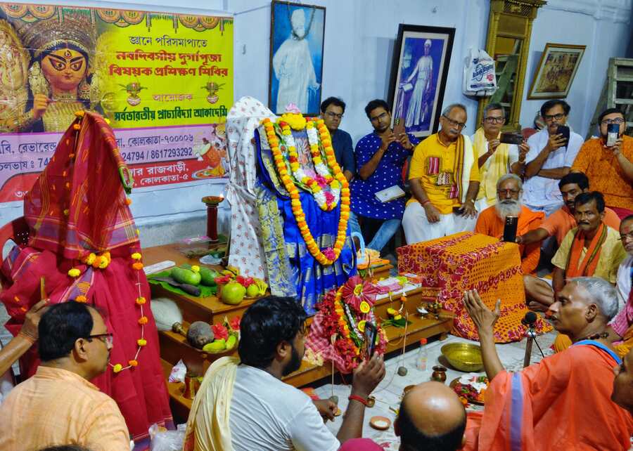 Priests practise puja rituals at Sovabazar Rajbari on Friday ahead of Durga Puja. This year, the puja will be held from October 9 to 12
