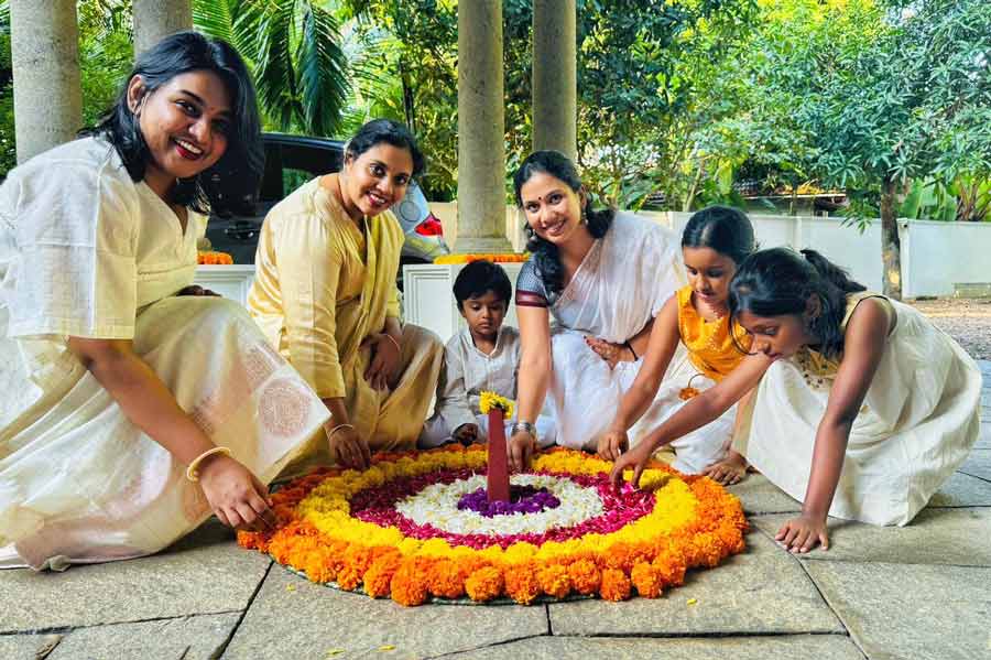 At the Nair household, women and children of the family participate in setting up the Pookalam in the morning. This year, it was no different