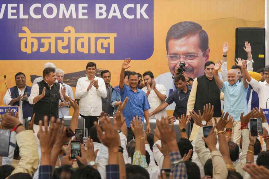 Arvind Kejriwal and other AAP leaders at a party workers' meeting in New Delhi on Sunday.
