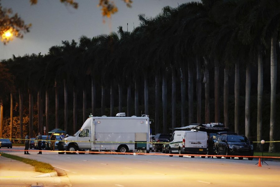 Police crime scene vehicles are seen at Trump International Golf Club after police closed off the area following the apparent assassination attempt of Republican presidential nominee former President Donald Trump in West Palm Beach.